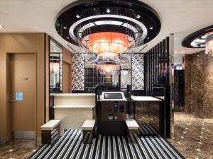 a lobby of a hotel with a chandelier at APA Hotel Ningyocho-eki Higashi in Tokyo