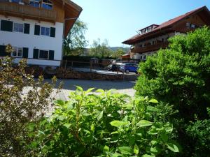 a view of a parking lot between two buildings at Gästehaus Johanna in Bad Wiessee