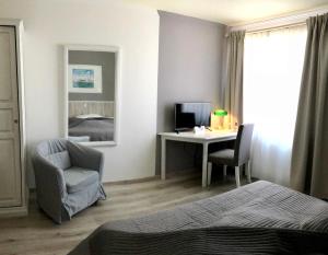 Postel nebo postele na pokoji v ubytování Hotel Toskana