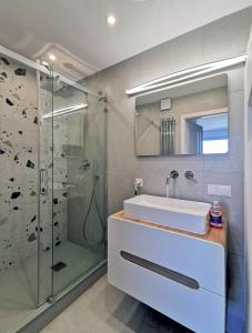 a bathroom with a sink and a shower at Pokoje przy plaży z widokiem na morze in Sopot +116 photos