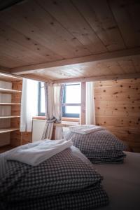 Postel nebo postele na pokoji v ubytování Gasthof Fallmühle