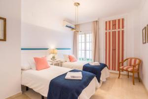 Posteľ alebo postele v izbe v ubytovaní TGH/ Málaga Soho centro