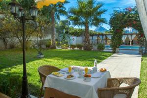 a table with food on it in a yard at Hotel Tossal d'Altea in Altea