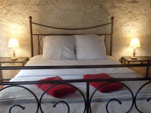 En eller flere senger på et rom på Chambres d´Hôtes Prieuré d'Orniols