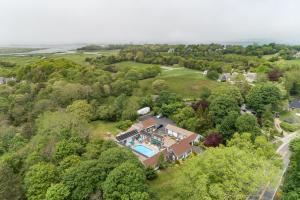 an aerial view of a house with a swimming pool at Lamb and Lion Inn in Barnstable