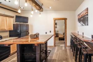 a kitchen with a wooden counter top in a room at The Adventure Inn Yellowstone in West Yellowstone