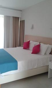 Postel nebo postele na pokoji v ubytování Nasos Hotel & Resort