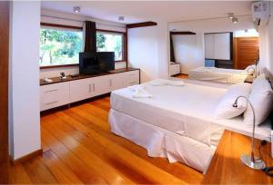 Postel nebo postele na pokoji v ubytování Casa Sabiá encanto e aconchego pertinho do mar