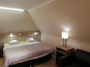 Postel nebo postele na pokoji v ubytování Arconaty Hotel