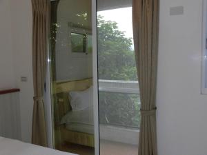 Postel nebo postele na pokoji v ubytování Shiang Ching Home Stay