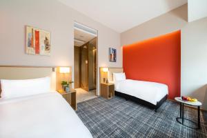 Letto o letti in una camera di Xence hotel Xiamen