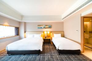 Letto o letti in una camera di Xence hotel Xiamen