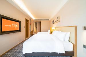 Letto o letti in una camera di Xence hotel Xiamen