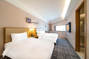 Letto o letti in una camera di Xence hotel Xiamen