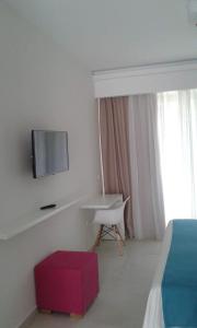 TV a/nebo společenská místnost v ubytování Nasos Hotel & Resort