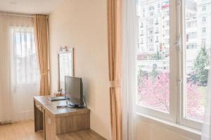 TV a/nebo společenská místnost v ubytování Nice Dream Hotel