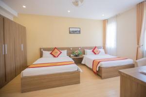 Postel nebo postele na pokoji v ubytování Nice Dream Hotel