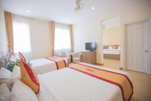 Postel nebo postele na pokoji v ubytování Nice Dream Hotel