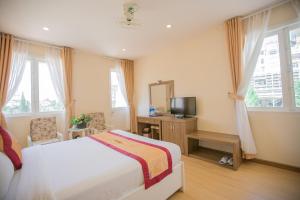 TV a/nebo společenská místnost v ubytování Nice Dream Hotel