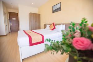 Postel nebo postele na pokoji v ubytování Nice Dream Hotel