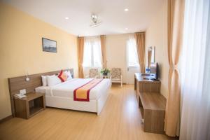 Postel nebo postele na pokoji v ubytování Nice Dream Hotel