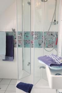 a bathroom with a shower and a sink at Casita in Apensen +26 photos