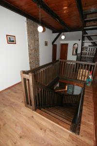 a room with a wooden staircase in a house at Penzion Semerink in Janov nad Nisou