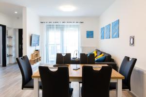 Televiisor ja/või meelelahutuskeskus majutusasutuses Apartman Fonyód