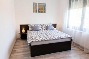 Voodi või voodid majutusasutuse Apartman Fonyód toas
