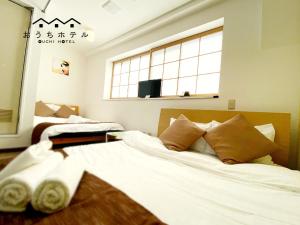 Ένα ή περισσότερα κρεβάτια σε δωμάτιο στο OUCHI HOTEL Yokogawa