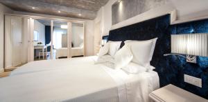 Postel nebo postele na pokoji v ubytování Hotel Aurelia
