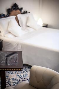 Postel nebo postele na pokoji v ubytování Hotel Aurelia