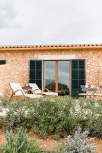 a group of chairs sitting on a patio at Finca Es Cabàs in Santa Maria del Camí +77 photos