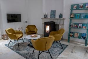 a living room filled with furniture and a fire place at B&B ARENA SEVILLA in Tomares