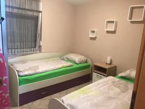 Postel nebo postele na pokoji v ubytování Apartman Petra 1