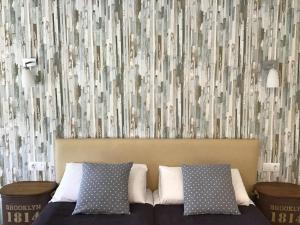 Кровать или кровати в номере Hotel Nómadas