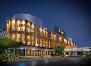 a lit up building at night with its lights on at Amari Don Muang Airport Bangkok in Bangkok