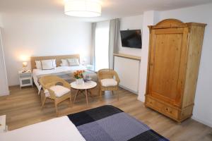 Postel nebo postele na pokoji v ubytování Hotel Weinlaube