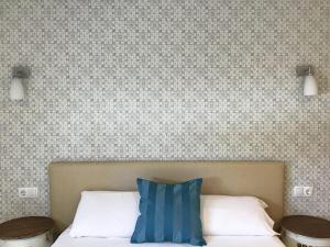 Кровать или кровати в номере Hotel Nómadas