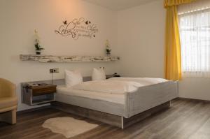 Postel nebo postele na pokoji v ubytování Hotel Rheingraf