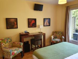 TV a/nebo společenská místnost v ubytování La Fraîchette-Hôtel & Spa