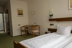 Postel nebo postele na pokoji v ubytování Hotel Rheingraf