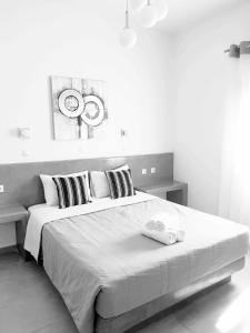 Ένα ή περισσότερα κρεβάτια σε δωμάτιο στο Hotel Leta 