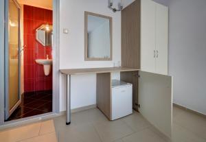 a bathroom with a sink and a mirror at HARMONY in Sozopol