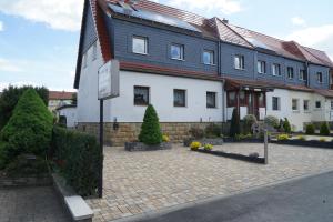 a large white building with a red roof at Pension Nr. 13 - B&B in Pirna