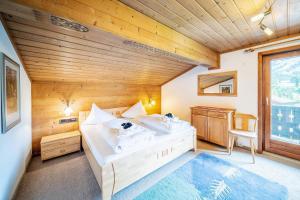 Posteľ alebo postele v izbe v ubytovaní Ferienhaus Sonnrain + 37 fotografií