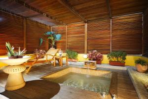 a room with a pool of water in the middle of a house at Seasons Boutique Motel in Kaohsiung
