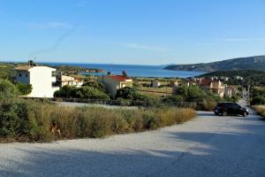 a car parked on the side of a road at Helen's Sounio Apartments in Sounio