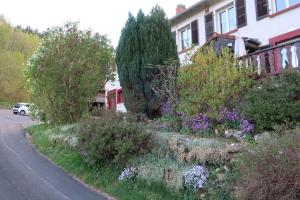 a house with a garden on the side of a road at BnB chambres d'hôtes le Chêne in Ban-sur-Meurthe-Clefcy