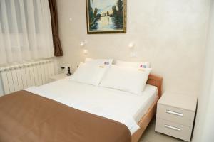 Katil atau katil-katil dalam bilik di Hotel Sunce